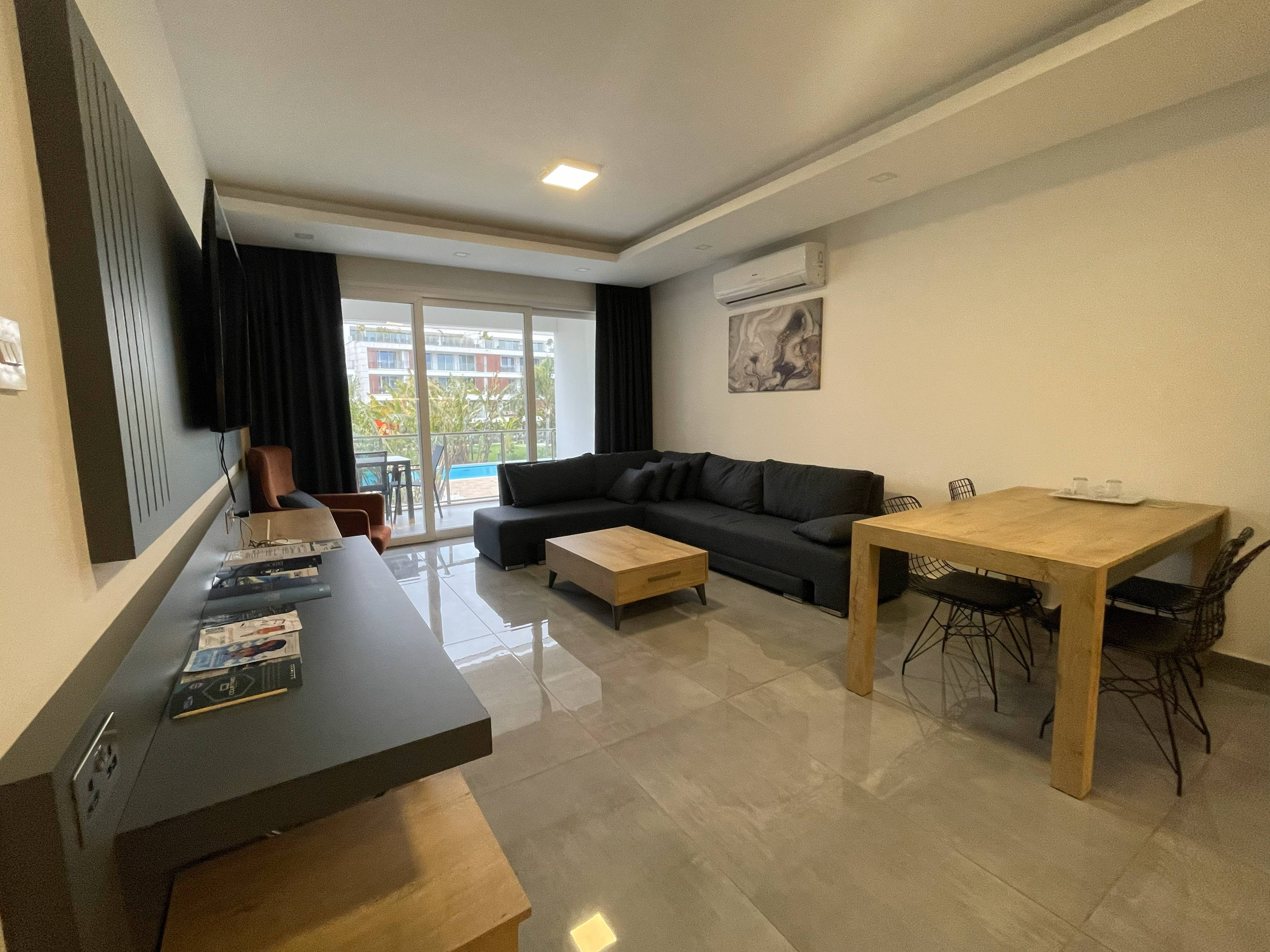 Deluxe 1+1 - Living Area with Pool View